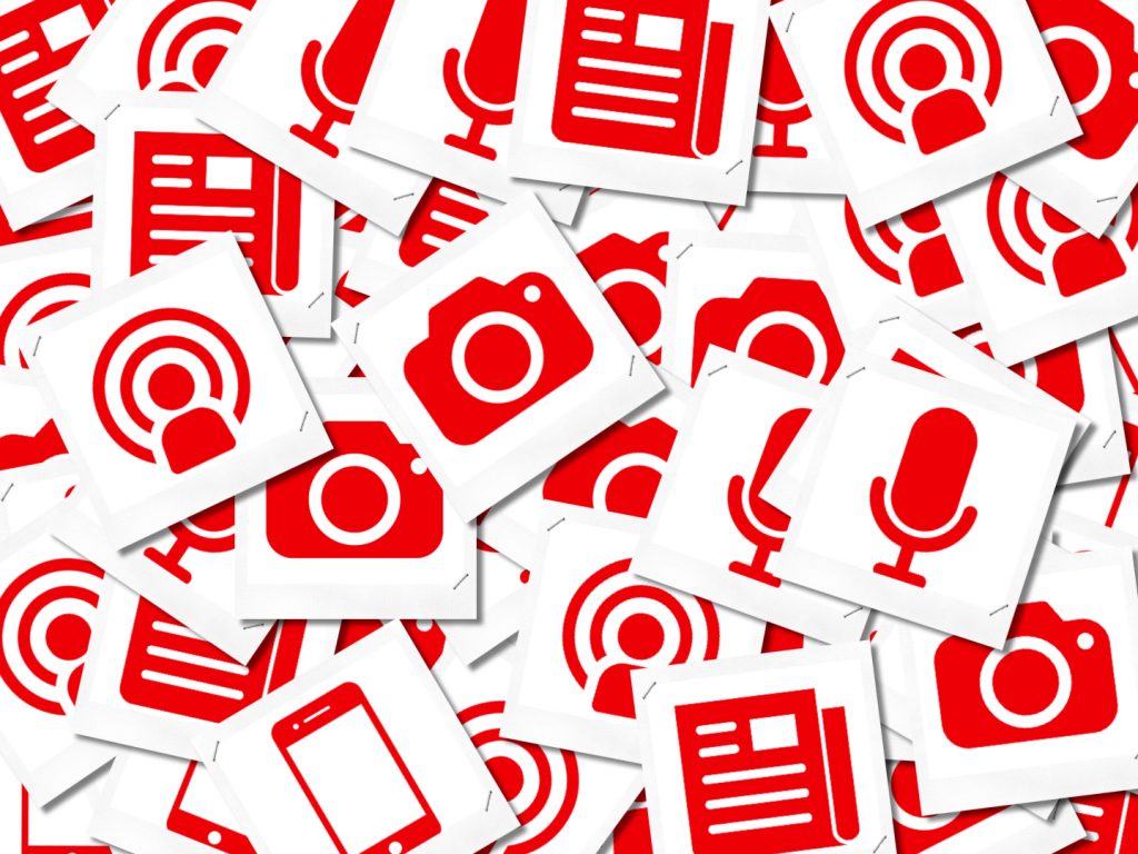 A collage of red icons representing various digital media services including photography and podcast production